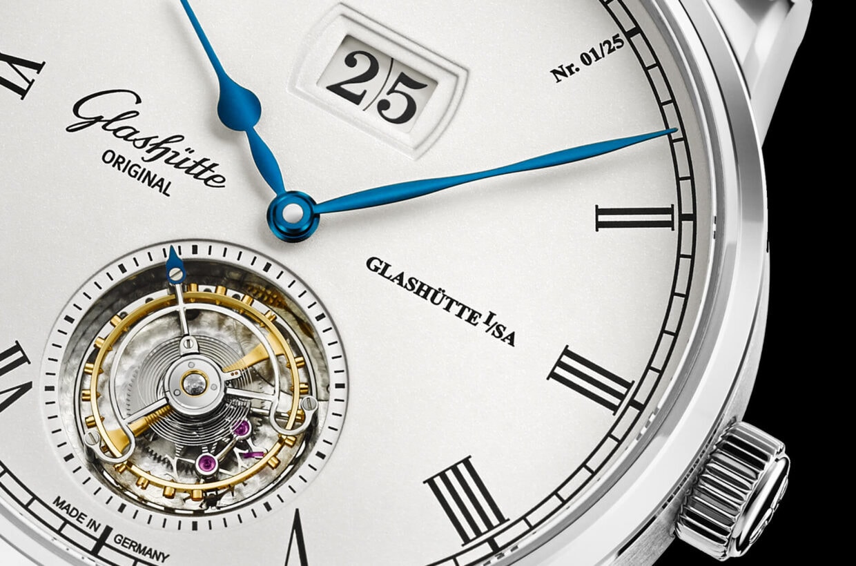 Visible whirlwind Flying Tourbillon on dial side, blued steel tip of tourbillon cage serves as seconds hand, positioning at 6 o’clock as visual counterpoint to Panorama Date at 12 o‘clock 