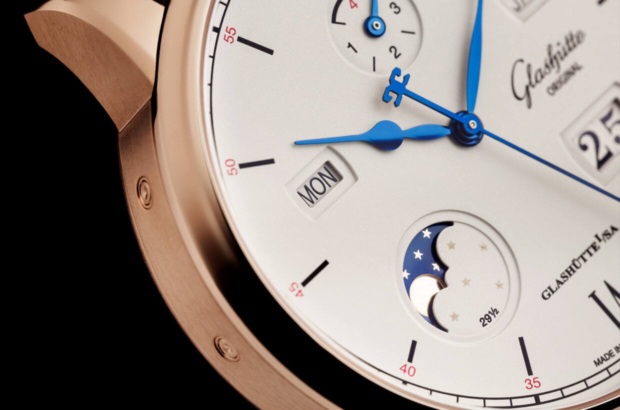 Moon phase in gold and blue Refined moon phase design takes up warm hues of the red gold case, domed gold-coloured moon set against galvanic blue sky with golden stars 